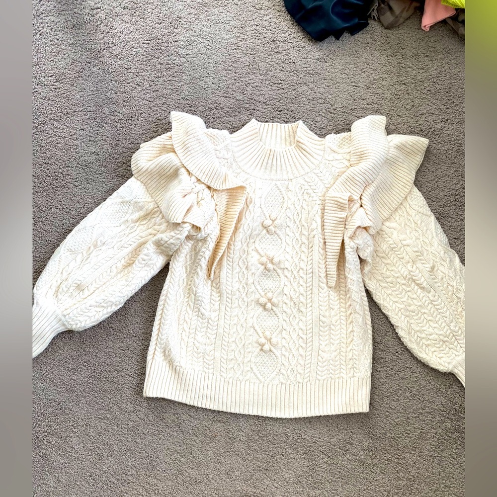 Cream cable knit sweater with ruffles
